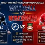 Nhận định trận đấu Millwall vs Wrexham vòng 4 Championship 2026/27. Cuộc đối đầu hấp dẫn giữa tiền đạo Joshua Coburn (Millwall) và trung vệ Callum Doyle (Wrexham) tại sân The Den.